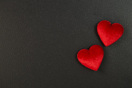 red heart felt black background. Valentine's Day card. declaration of love textureの写真素材