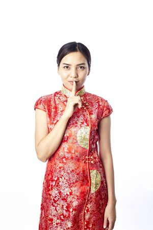 Asian girl greeting in traditional Chinese new yearの写真素材