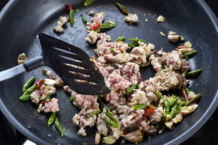 Stir-fried pork with basil leaves In the pan, food thai