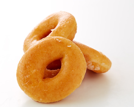 Glazed donutson a white background. Macro with shallow dofの写真素材