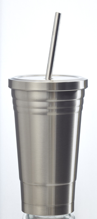 Steel mug isolated on white background. Big stainless cup for your design.の写真素材