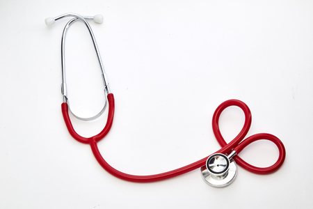 Red Curled Stethoscope Isolated on White Backgroundの写真素材