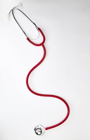 Red Curled Stethoscope Isolated on White Backgroundの写真素材