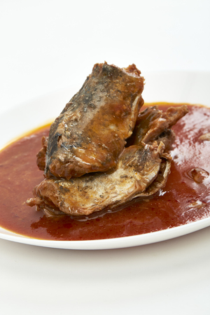 Mackerel in Tomato Sauce on white backgroundの写真素材