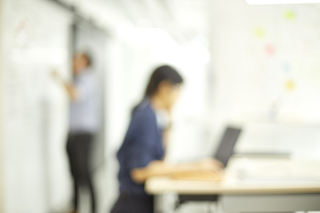 Business meeting blurred. brainstorming at meeting room. advertisement company discussion together. Young colleagues sitting at the business meeting in the office.の写真素材