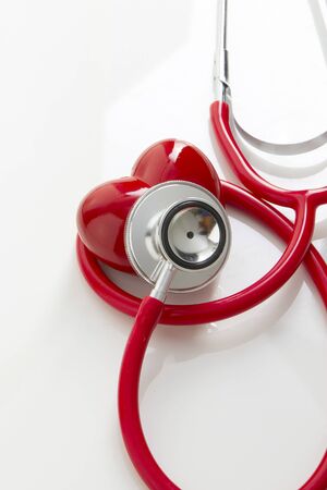 rendering stethoscope and red heart on white backgroundの写真素材