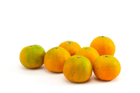 Fresh yellow oranges isolated on white backgroundの写真素材