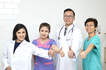 Asian  doctor and nurse madical team in hopital, Different ages, illness consultantの写真素材