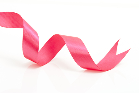 Pink curly ribbon isolated on white backgroundの写真素材