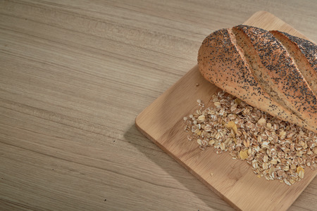 Fresh baked bread on rustic wooden background