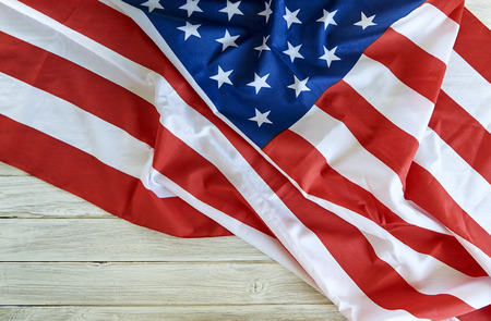 Flag of the USA on white wooden background