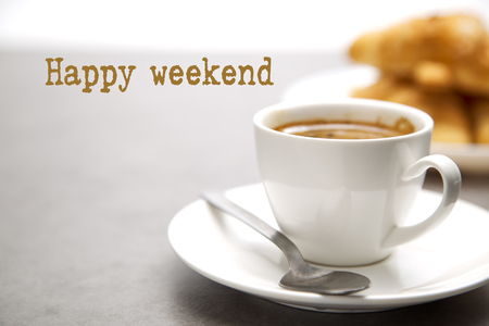 Cup of fresh hot coffee with croissants on dark wood backgroundの写真素材