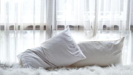 Abstract white bedroom with white curtain on windowの写真素材