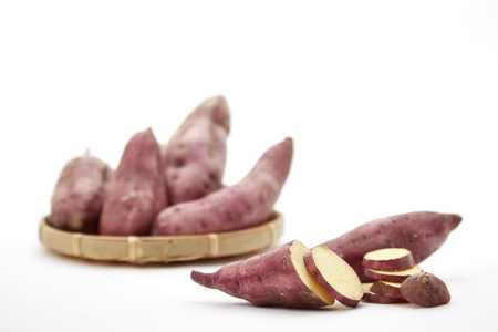 Organic Vegetables sweet potato on the white background, copy paceの写真素材