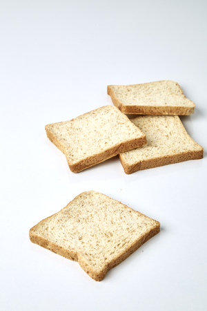 slices of whole wheat bread isolated on white background