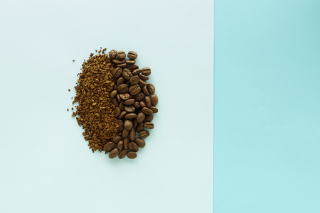 Coffee beans on paper blue minimal background, food flat lay, concept minimal backgroundの写真素材