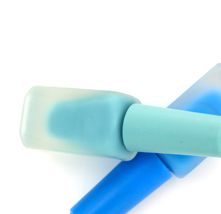 Blue nail polish with green nail polish on white background, Lady beauty conceptの写真素材