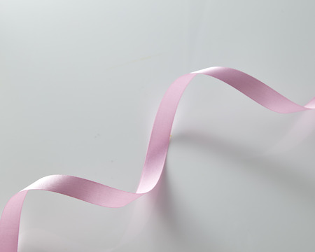 Pink curly ribbon isolated on white backgroundの写真素材