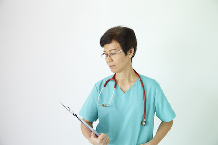 Medical professional with holding clipboard and stethoscope on white backgroundの写真素材