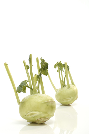 Two trimmed kohlrabi isoalted on a white backgroundの写真素材