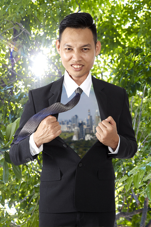 Asian young confident businessman standing on a studio in front white background. handsome businessman happy smile, Financial conceptの写真素材