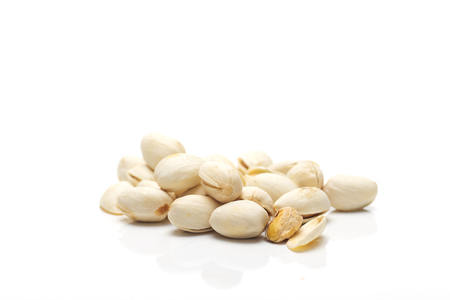 Pistachios isolated on white background with copy space for your textの写真素材