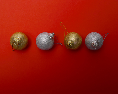 High angle view Christmas balls on red papar background, with space for your textの写真素材