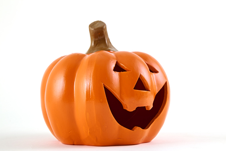 Halloween pumpkin cartoon has a happy face on a white background. There is an empty design theme, Light of the Moon, at midnight.の写真素材