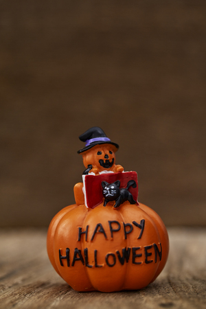 Creative Composition for Halloween Pumpkin Toy Decoration on wooden table background Holiday Ideas for Halloween Party Decoration with Trick or Treat, Moonlight in the roomの写真素材