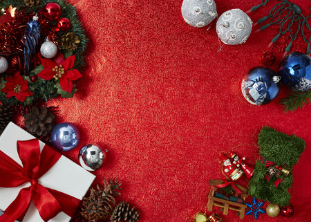 Happy New Year and Merry Christmas. New Year red paper background with spruce and decorations of balls, For the holiday background designの写真素材