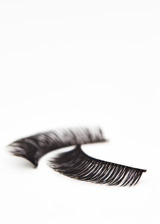 Composition with eyelashes on white backgroundの写真素材