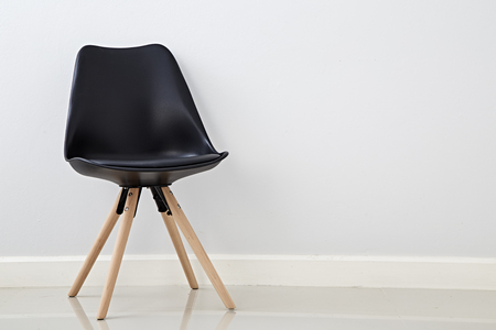 Black Cozy chair on empty white wall background, Copy space, Simple interior conceptの写真素材
