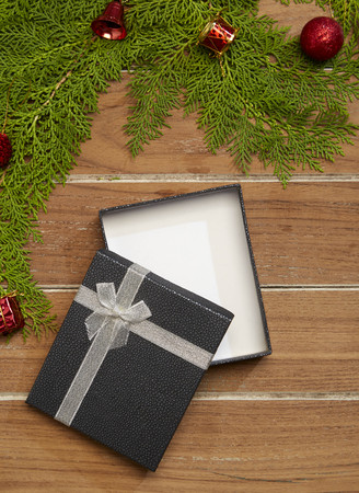 Christmas ornaments 2019 border with fir tree branches with Gift Box and new year ornaments rustic...