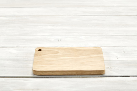 Cutting board top view on wooden white wooden with copy space, Empty space for design,