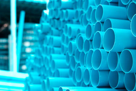 background of colorful  Blue PVC pipes stacked in construction site
