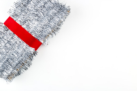 Christmas traditional decorations silver tinsel on white background. Xmas ribbon garland isolated realistic decor elementの写真素材