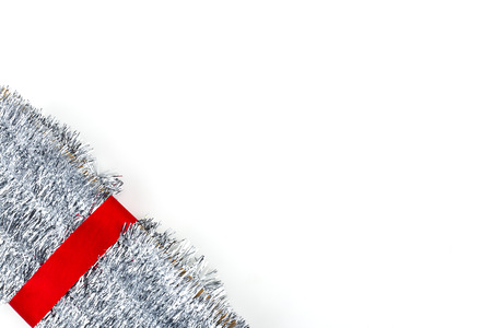 Christmas traditional decorations silver tinsel on white background. Xmas ribbon garland isolated realistic decor elementの写真素材