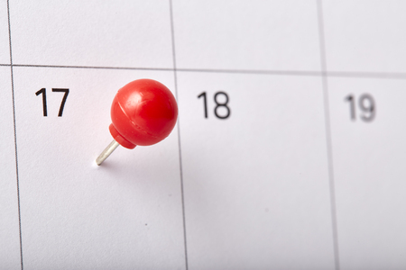 Red thumbtack a date 17th on calendar or planner. Tax Day 2018 takes place on April 17. selective focusの写真素材
