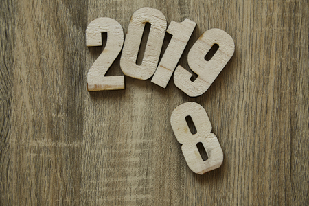 Work goal concept New Year 2019 Background workspace frame on wooden background .flat layの写真素材