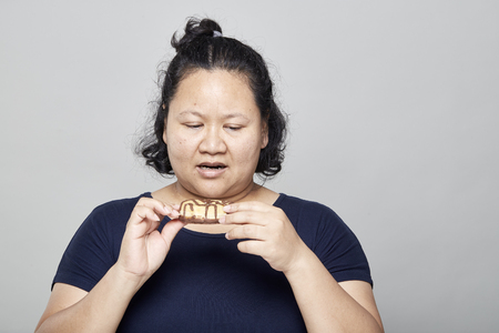 Fat Asian women on white wall background, Healthy Weight Loss Ideasの写真素材