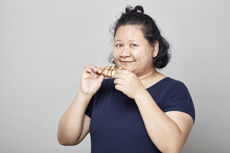 Fat Asian women on white wall background, Healthy Weight Loss Ideasの写真素材