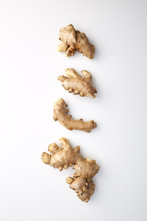Healthy Fresh Ginger root with medicinal properties and is the elixir on white backgroundの写真素材