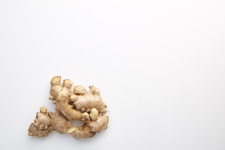 Healthy Fresh Ginger root with medicinal properties and is the elixir on white background