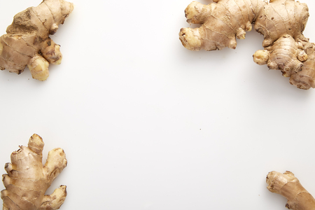 Healthy Fresh Ginger root with medicinal properties and is the elixir on white backgroundの写真素材