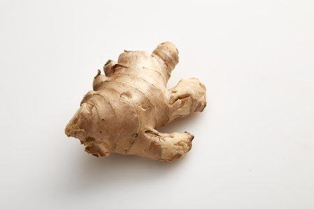 Healthy Fresh Ginger root with medicinal properties and is the elixir on white backgroundの写真素材