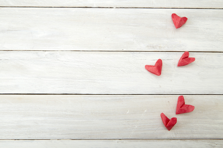 Love hearts on wooden texture background. Valentines day card conceptの写真素材