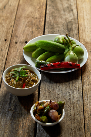 Thai food, Fermented fish spicy dip on wood, dark food photographyの写真素材