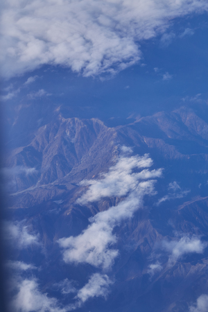 Beautiful blue sky and white cloud and landscape view from the plane in Japanの写真素材