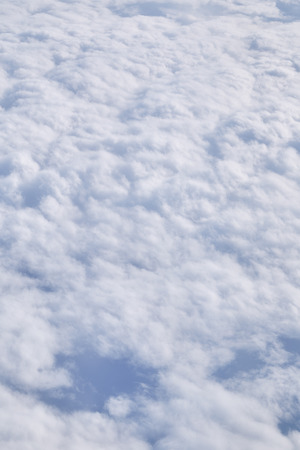 Beautiful blue sky and white cloud and landscape view from the plane in Japanの写真素材
