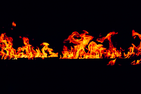 Blurred Bright Red and Orange Firestorm Texture on Black  (Real Fire), shot of flying fire sparksの写真素材